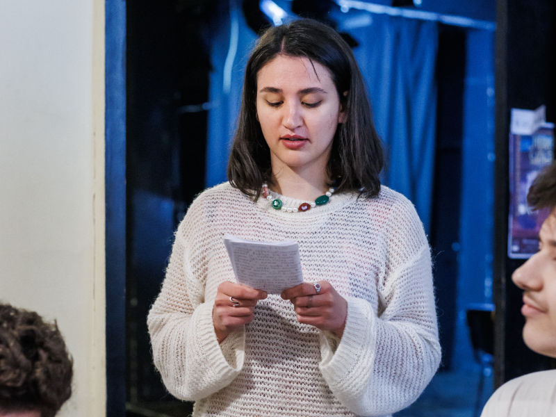 Silvana Gateva in a thetre workshop, reading a text from a piece of paper.